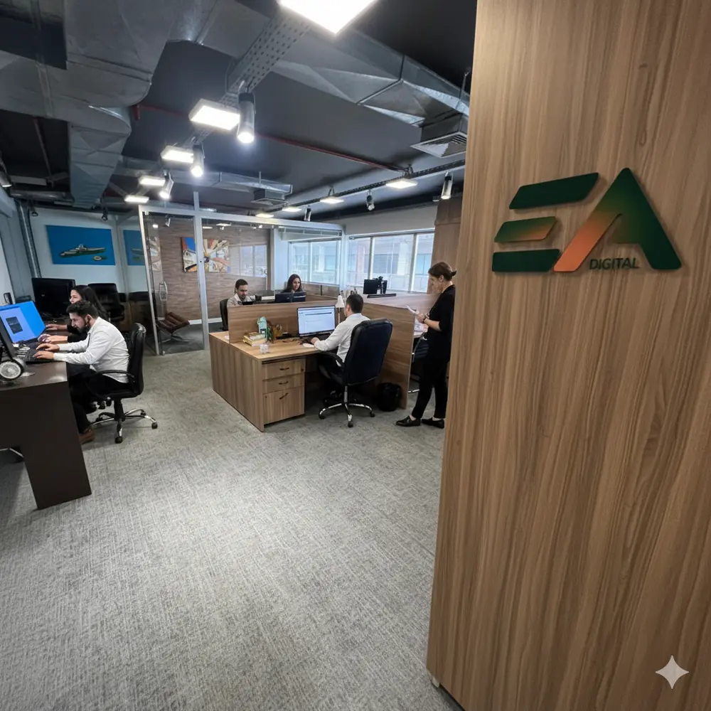 Ilustração de um escritório com equipe trabalhando e o logo EA na parede